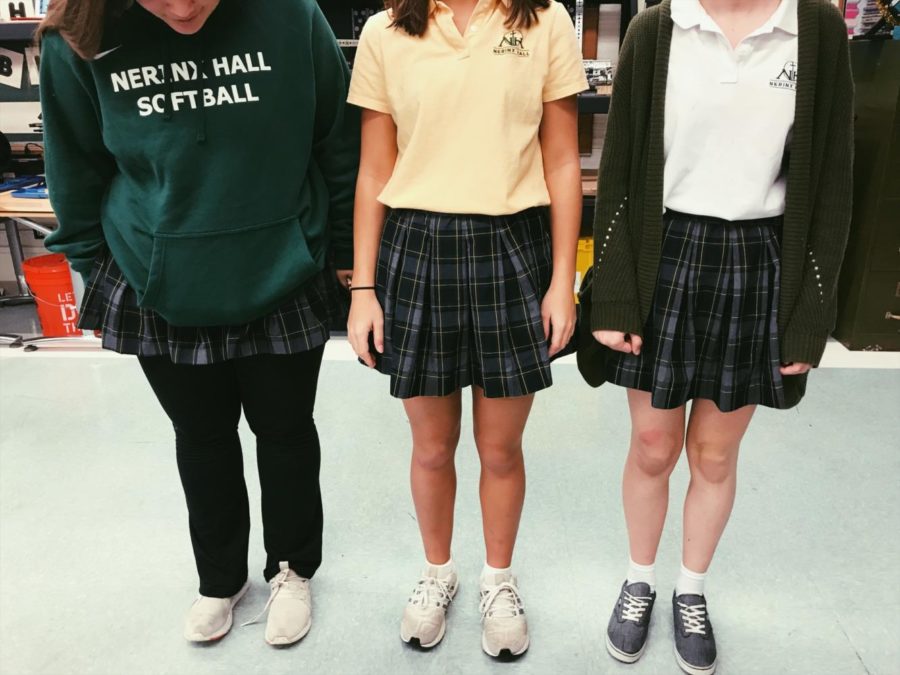 Juniors Ava Neels, Claire Teng, and Hannah Dillon show off their varying uniforms 